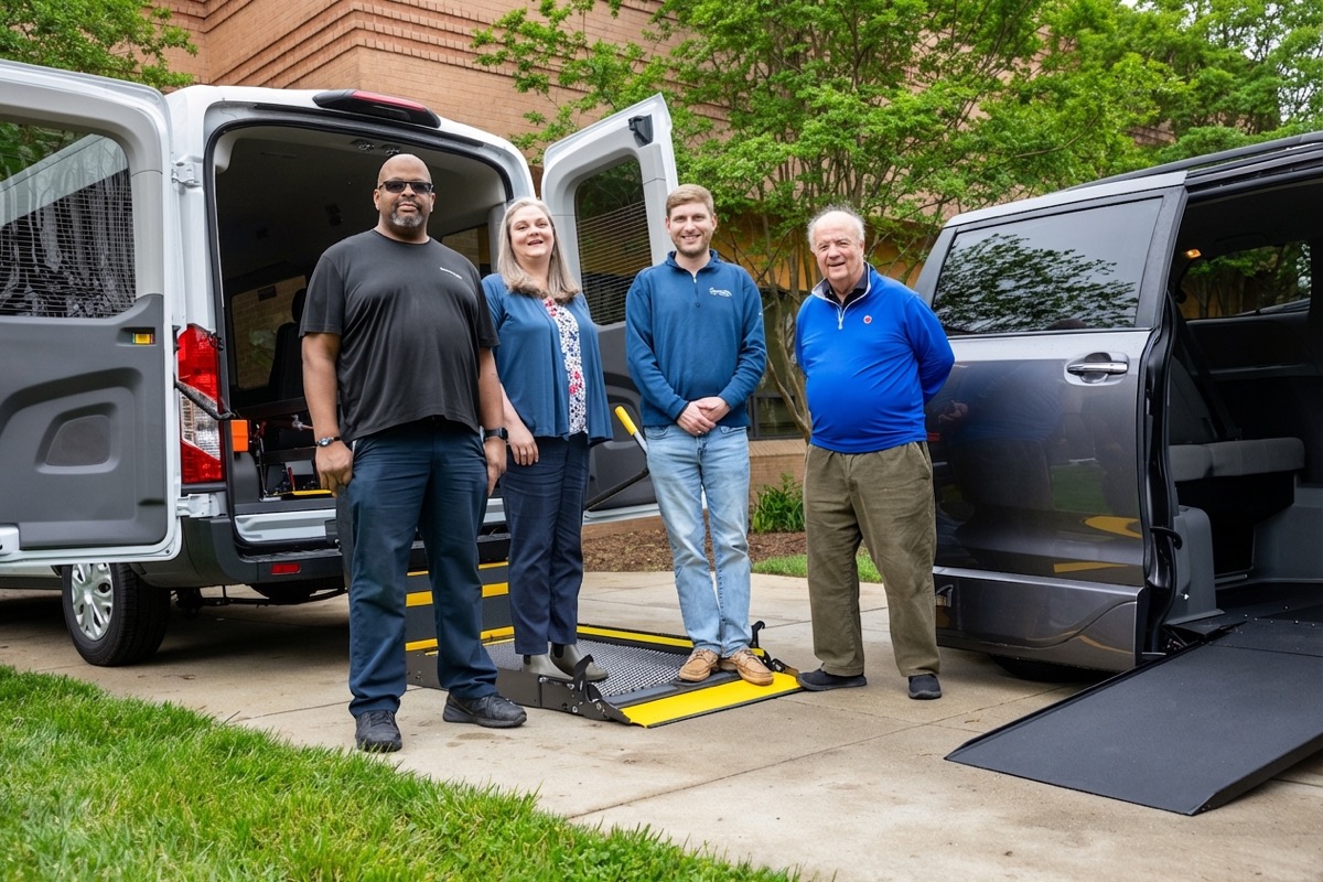 Apple Ford Mobility Center team with wheelchair van and accessible minivan